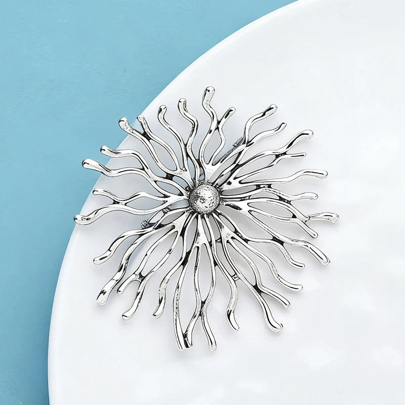soleil brillance broches