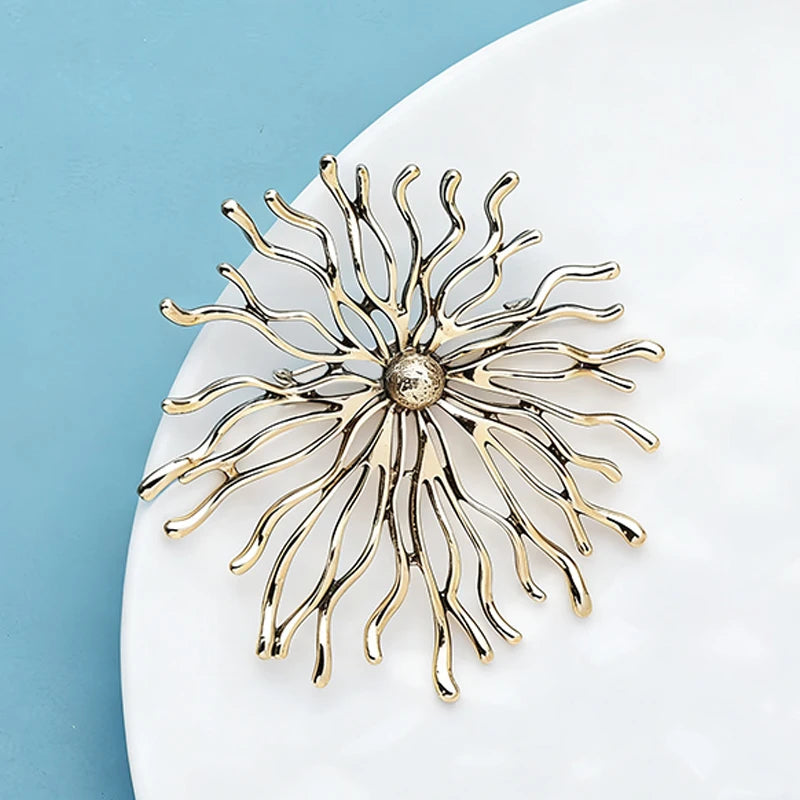 soleil brillance broches